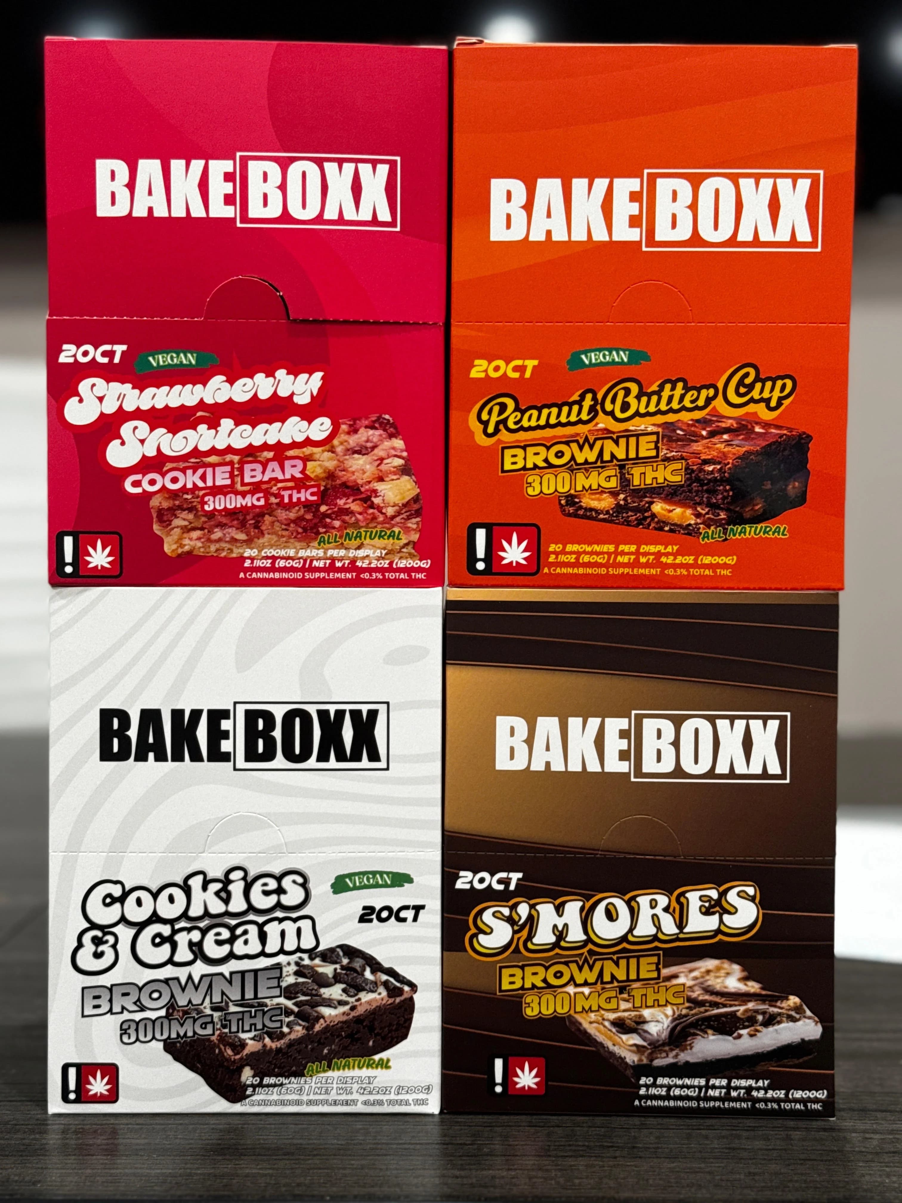 Edibles stacked up one on top of anotherm featuring Strawberry Shortcake, Peanut Butter Cup Brownie, Cookies & Cream Brownie, and S'Mores Brownie.